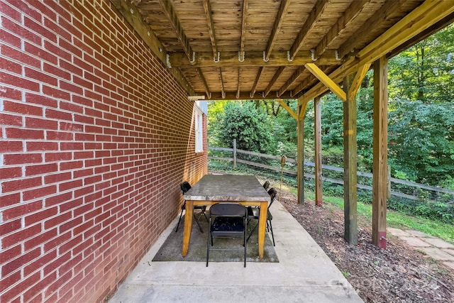 view of patio / terrace with outdoor dining area and fence