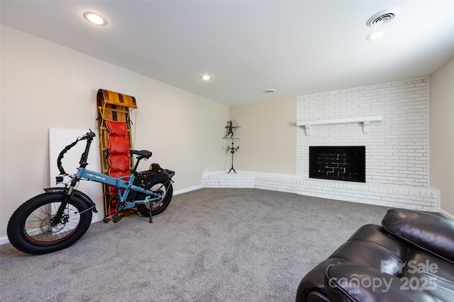 interior space with a fireplace and carpet