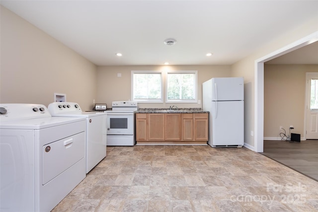 washroom featuring sink and independent washer and dryer