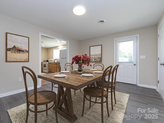 dining room featuring dark hardwood / wood-style floors