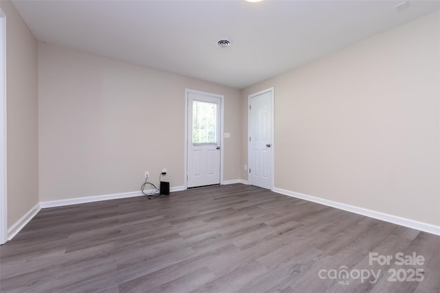 spare room featuring hardwood / wood-style floors