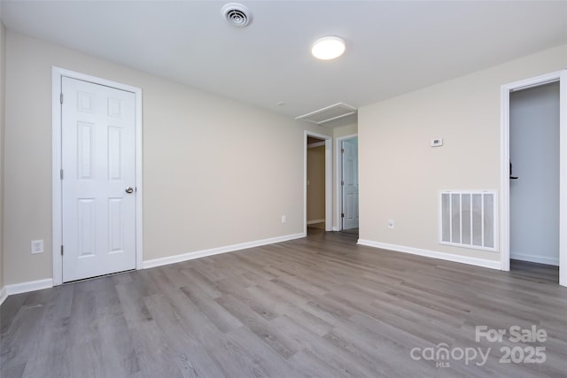 spare room with light hardwood / wood-style floors