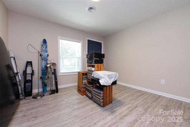 miscellaneous room with light wood-type flooring