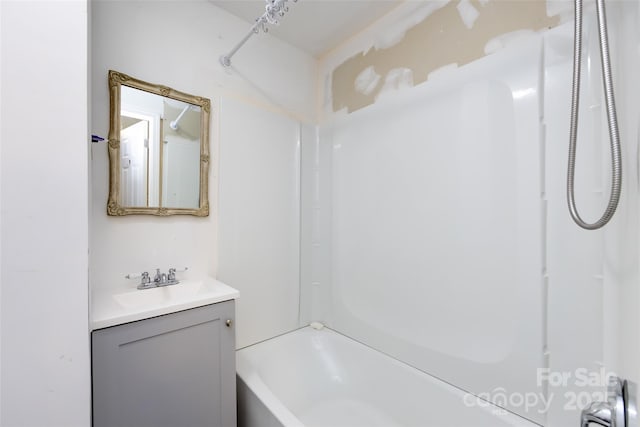 bathroom with shower / washtub combination and vanity