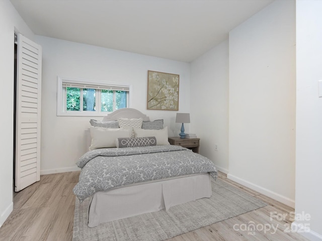 bedroom with light wood-type flooring