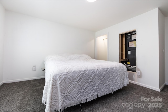 bedroom featuring dark carpet