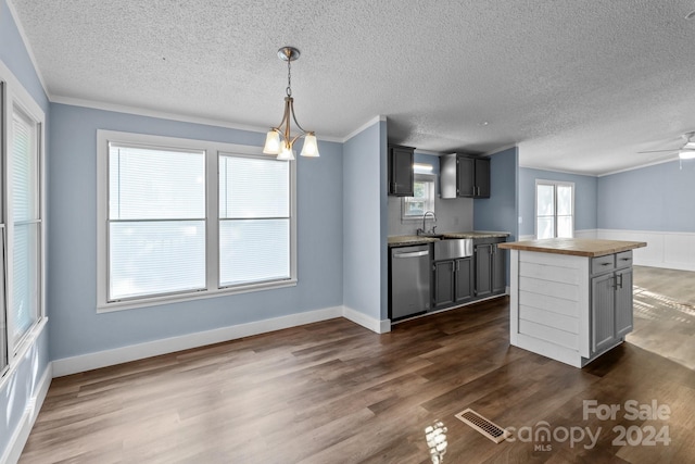 kitchen with gray cabinetry, hanging light fixtures, dark wood-type flooring, and stainless steel dishwasher