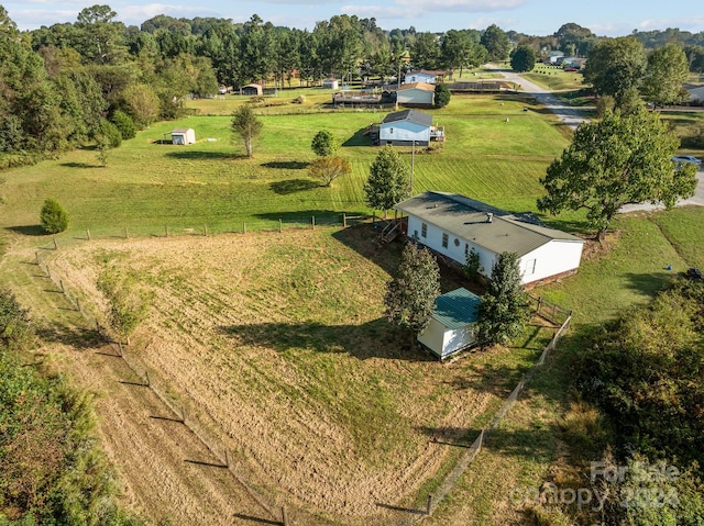 birds eye view of property with a rural view