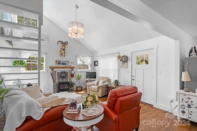 living room featuring high vaulted ceiling, light hardwood / wood-style floors, a chandelier, and plenty of natural light