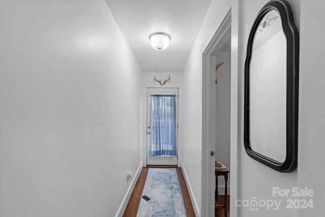 entryway with hardwood / wood-style floors