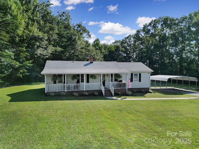 ranch-style home with a front yard, a carport, and covered porch