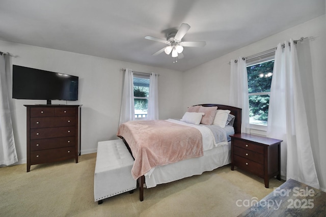 carpeted bedroom featuring ceiling fan