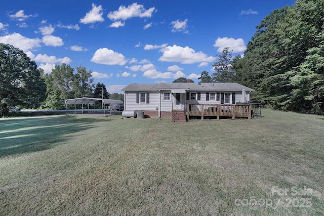 view of front of property featuring a wooden deck, a front lawn, and a carport