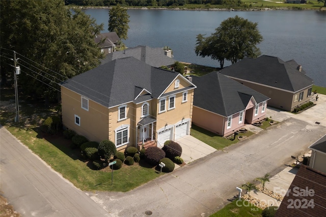 birds eye view of property with a water view