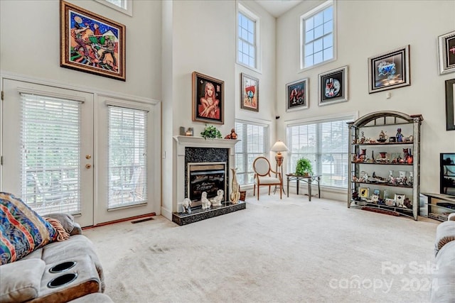 living room with light carpet and plenty of natural light