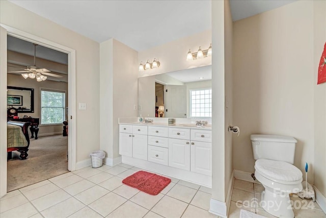 bathroom with vanity, toilet, ceiling fan, and tile patterned floors