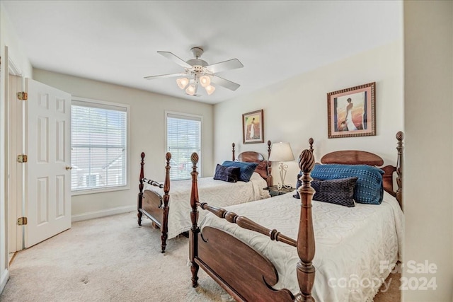 bedroom featuring ceiling fan and light colored carpet