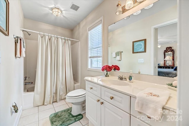 full bathroom with vanity, toilet, tile patterned floors, and shower / bath combo with shower curtain