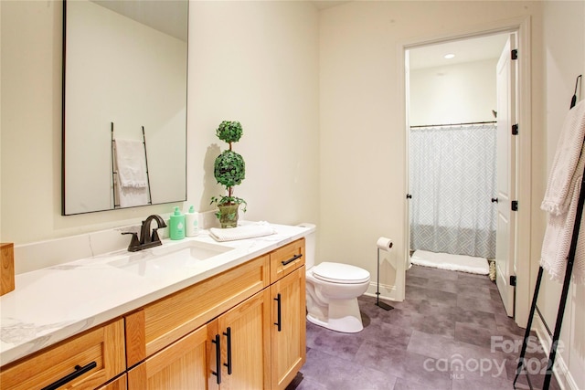 bathroom featuring tile patterned floors, a shower with shower curtain, vanity, and toilet