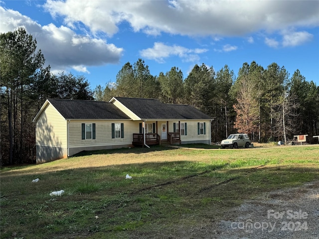 ranch-style house with a front lawn