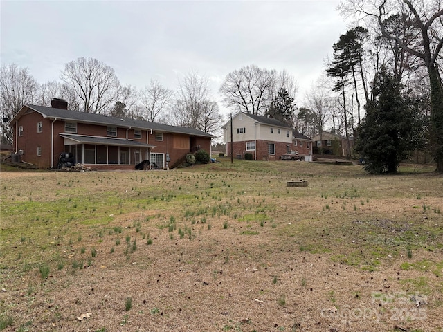 view of yard with a sunroom