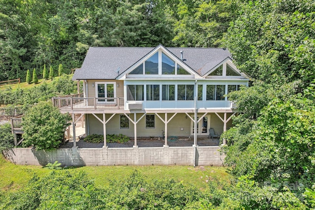 rear view of house with a patio area and a deck