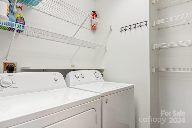 clothes washing area featuring washing machine and clothes dryer