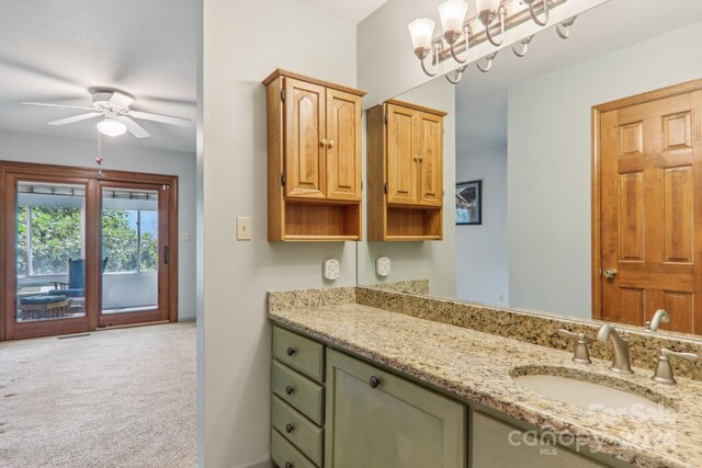 bathroom featuring ceiling fan and vanity