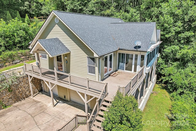 view of front of house featuring a wooden deck and a garage