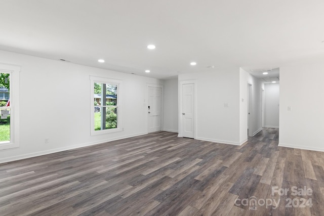 unfurnished room with wood-type flooring