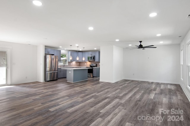 unfurnished living room with recessed lighting, dark wood finished floors, and ceiling fan