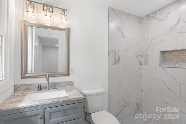 bathroom featuring toilet and vanity