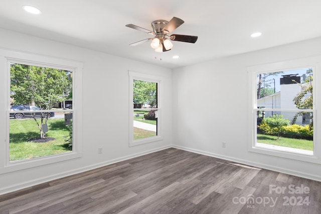 empty room featuring recessed lighting, wood finished floors, ceiling fan, and plenty of natural light