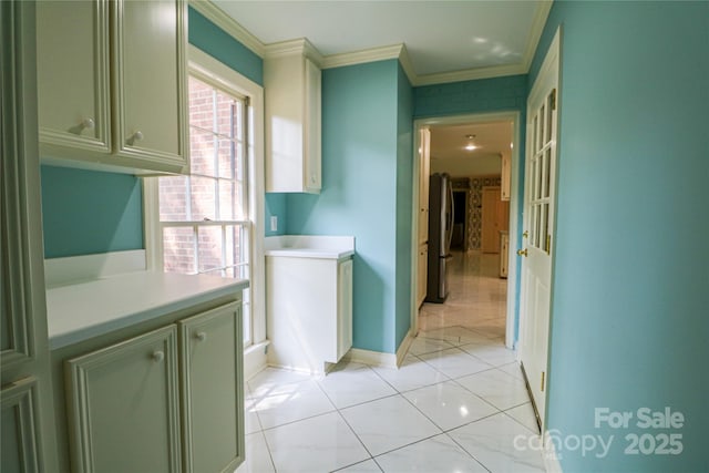 hallway featuring light tile patterned floors and ornamental molding