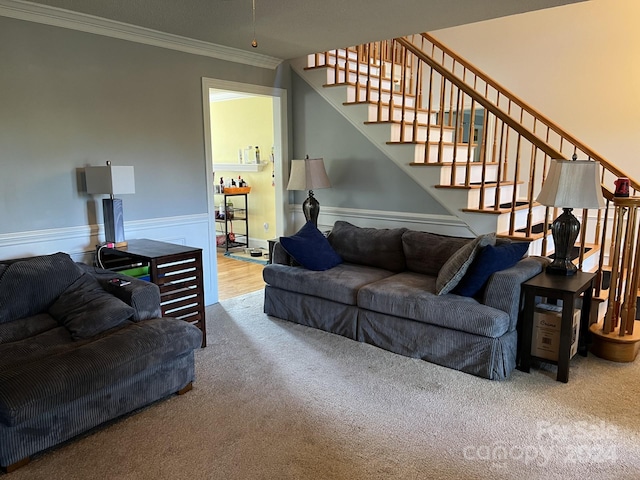 carpeted living room with ornamental molding