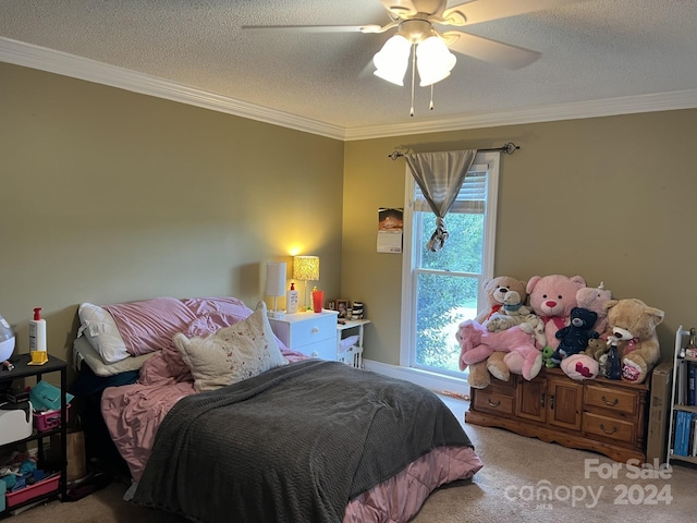 carpeted bedroom with ceiling fan, a textured ceiling, and crown molding