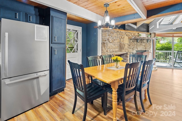 dining space with wooden ceiling, a chandelier, light wood-type flooring, and a healthy amount of sunlight