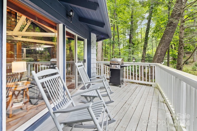 wooden terrace with area for grilling