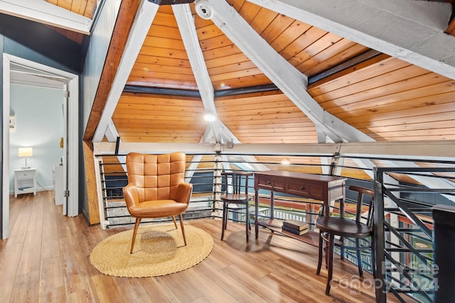 living area with vaulted ceiling with beams, wood ceiling, and light hardwood / wood-style flooring