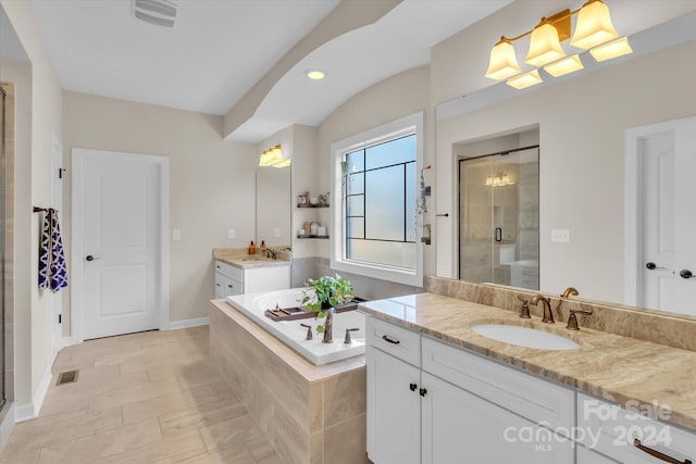 bathroom with vanity, tile patterned floors, and independent shower and bath