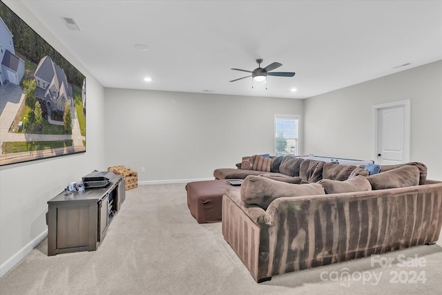 living room featuring ceiling fan and light colored carpet