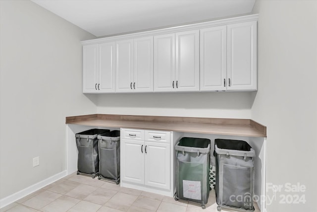 laundry room featuring light tile patterned floors