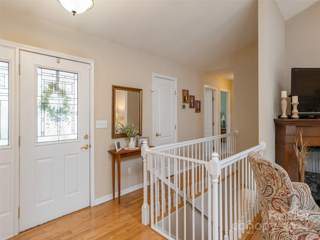 entryway with light hardwood / wood-style floors