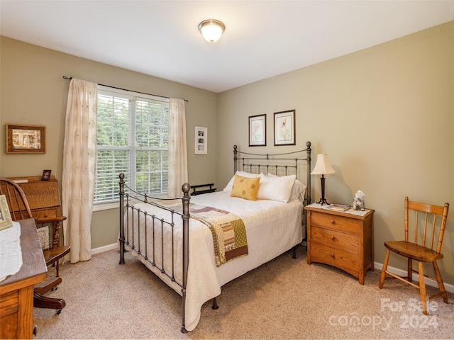 bedroom with light carpet