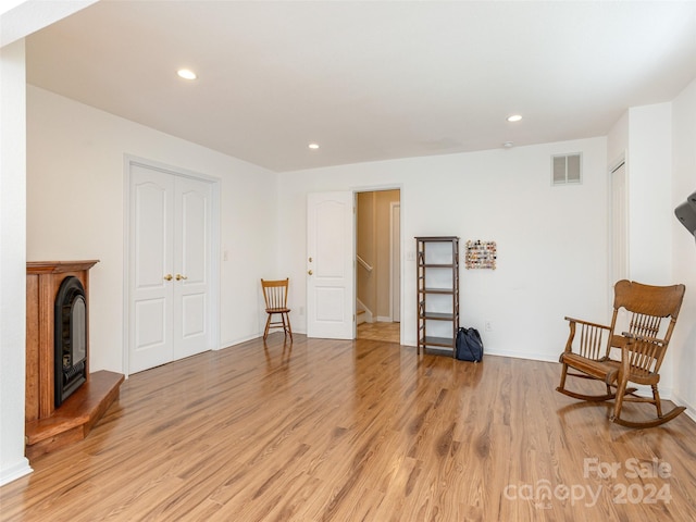 sitting room featuring light hardwood / wood-style floors