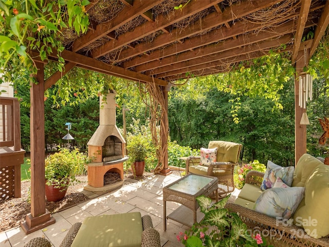 view of patio / terrace with an outdoor living space with a fireplace