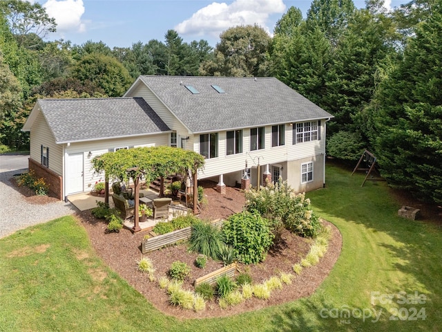 view of front of house with a front lawn and a playground