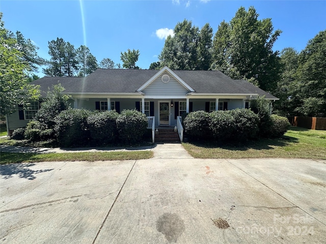 single story home with covered porch