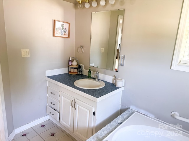 bathroom with vanity and tile patterned floors