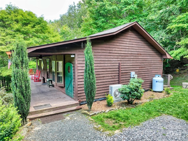 view of side of property with ac unit